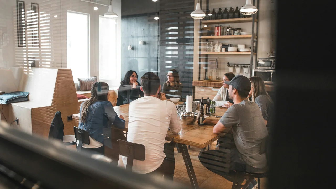 Executives meeting at a dealership conference table.